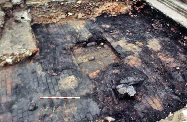 Thick carbonised layers covered much of the scorched brick floor  (c Museum of London)