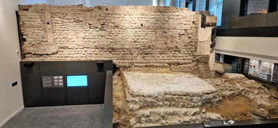 The Roman wall and bastion as newly displayed: compare to the previous photo of the remains as excavated, and the now concealed section of the chamfered sandstone plinth
