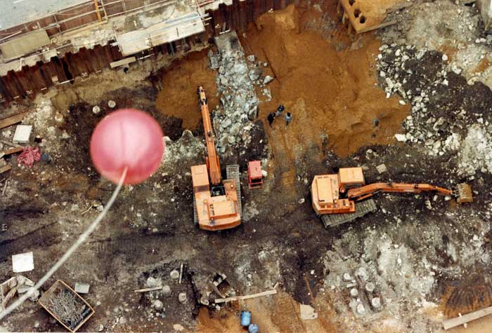 Red balloon fluttering from the tower crane on Gutter Lane, three of the archaeologists can be seen far below on Terra Firma 